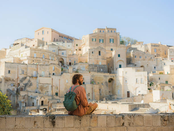 istock Man walking on quaint streets in Matera, Italy 2208234705