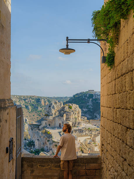istock Man walking on quaint streets in Matera, Italy 2208236888
