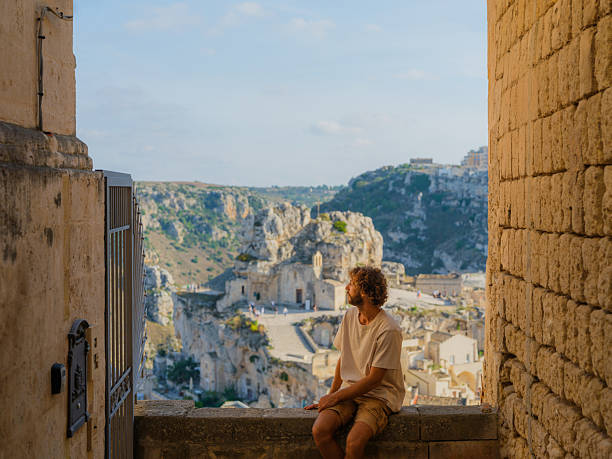 istock Man walking on quaint streets in Matera, Italy 2208236890