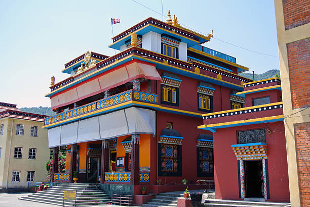 istock This image depicts a vibrant, multi-tiered temple or monastery with bright, contrasting colors and intricate decorative details. 2208238739