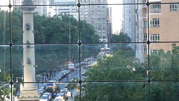 New York City Columbus Circle on Broadway street, Central Park. Manhattan Midtown architecture, USA. New York City, United States - 14 Sept 2023: Columbus Circle on Broadway street near Central Park. Manhattan Midtown architecture, USA. Urban life, road car traffic thru window of Deutsche Bank Center time warner center columbus circle pictures stock pictures, royalty-free photos & images