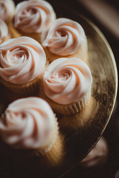 Light pink cupcakes with frosting