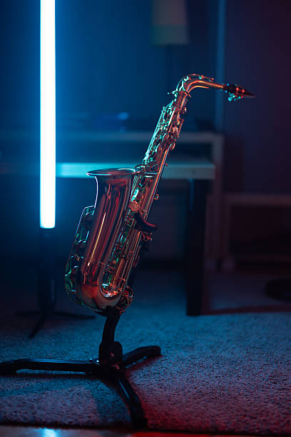 Saxophone in neon lit room without people