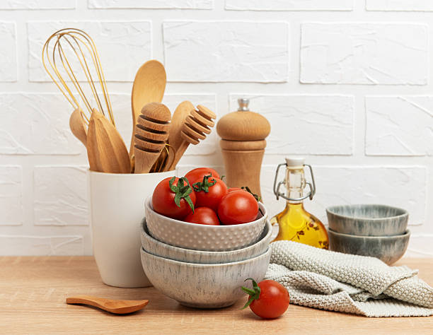 istock Kitchen utensils, tomatoes and olive oil creating a rustic culinary scene 2208244360