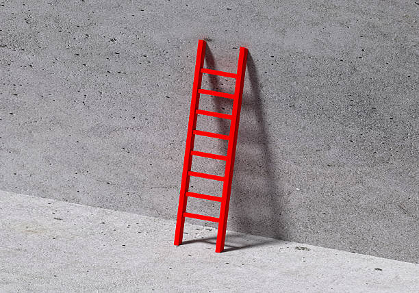Red metal ladder in an empty room