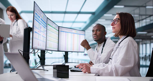 istock Medical Billing Manager Demonstrating Healthcare Codes 2208247525