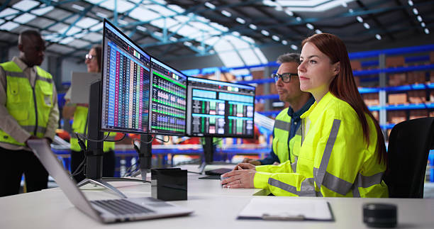 istock Managers In Office Oversee Warehouse Inventory 2208247538