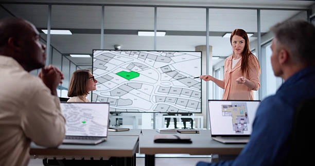istock Team Of Diverse Professionals Studying Cadastre Land Map 2208247570