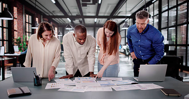 istock Diverse Analyst Group Meeting To Discuss Financial Data 2208247670