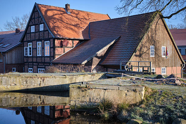 istock Bruchmuehle in Bruchhausen-Vilsen, with half-timbered house and reflection 2208248260