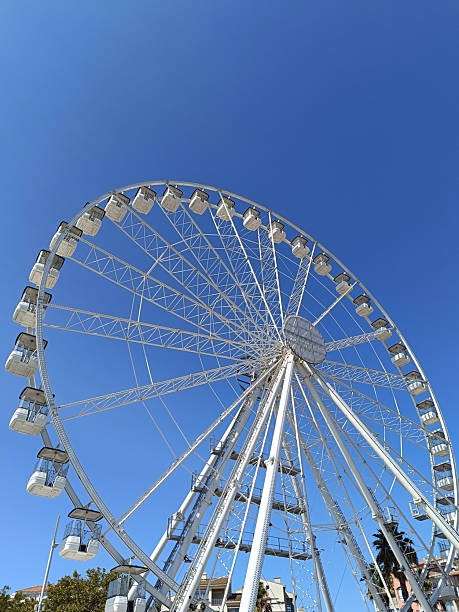 istock merry-go-round, Ferris wheel under a blue sky 2208251141