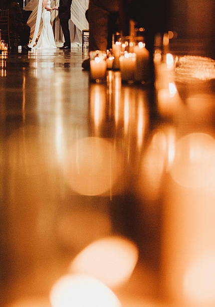 Candlelight wedding ceremony at night with aisle and abstract candles
