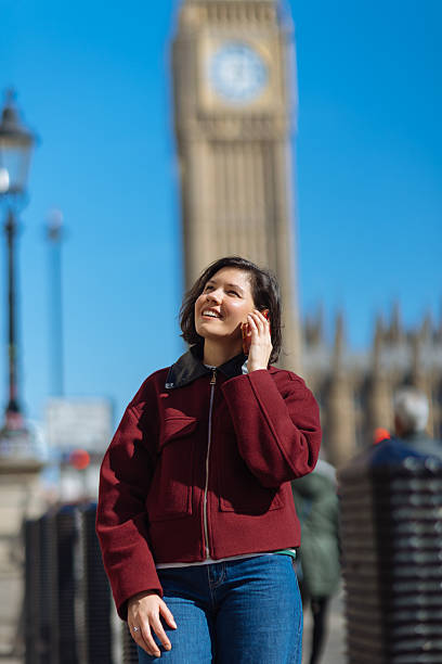 istock Woman using phone at Westminster in London 2208252786