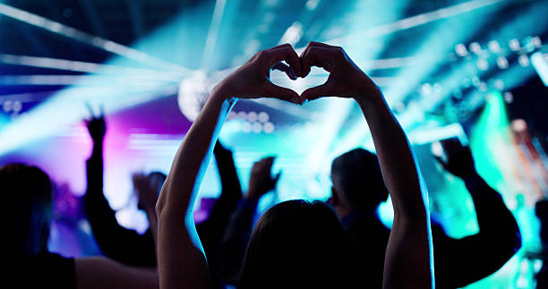 istock Joyful Fans Dance In Silhouette 2208253494