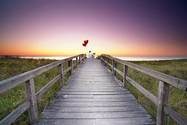 istock happiness on the wooden pier in sunset light 2208261354