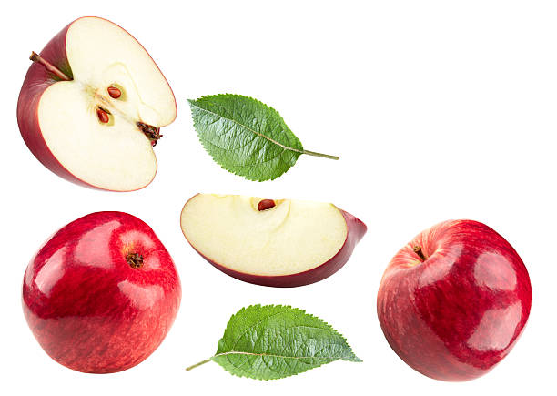 istock red apples with green leaf and half isolated on white background. clipping path 2208261532