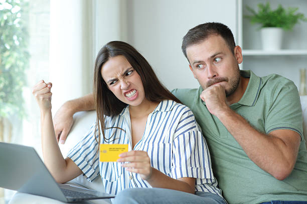 istock Angry couple having problems buying online 2208261646