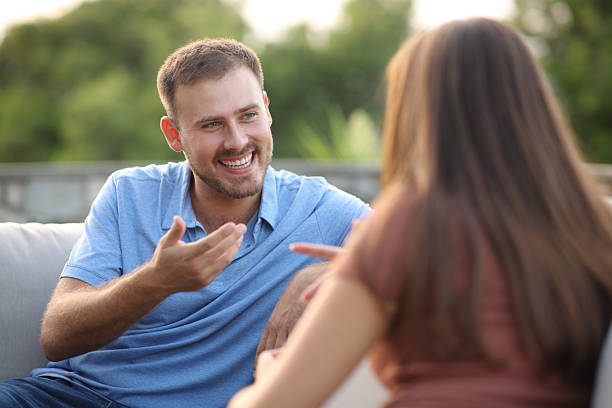 istock Friends or couple talking in a terrace 2208262180