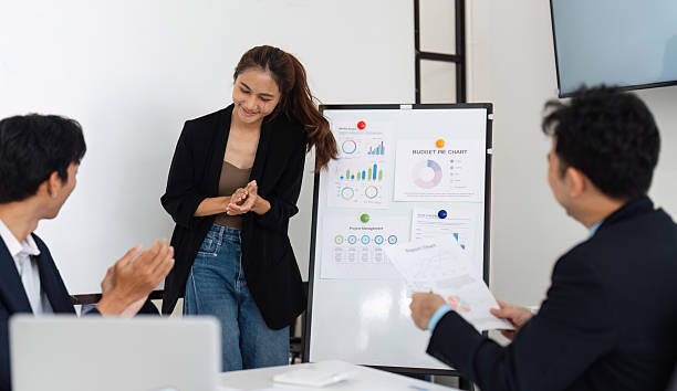 istock Engaging Presentation and Positive Response. A young woman enjoys the interaction after sharing insights. 2208266050