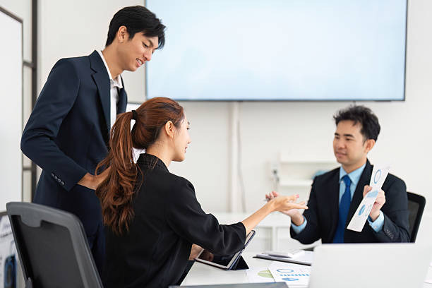 istock Strategic Discussion and Engagement. A professional team analyzing data together, fostering a collaborative environment. 2208266201