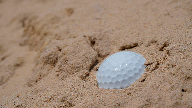 istock Golf ball on the sand in beautiful golf course at sunset background. 2208267506