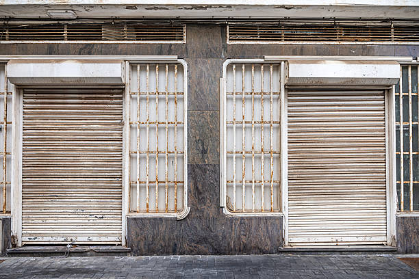 istock Bankrupt shop with roll-down shutters 2208268375