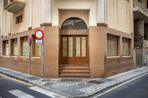 Arrecife, Canary Islands, Spain - March 2nd 2025: Bankrupt shop with windows and doorway covered with brown paper which is a common sight in the center of the main city on the Canary island