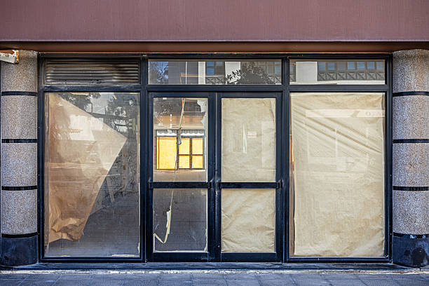 Bankrupt Spanish shop with windows boarded up with kraft paper. The picture is taken in Arrecife which is the main city on the Canary island Lanzarote. Empty shops is an issue in the city
