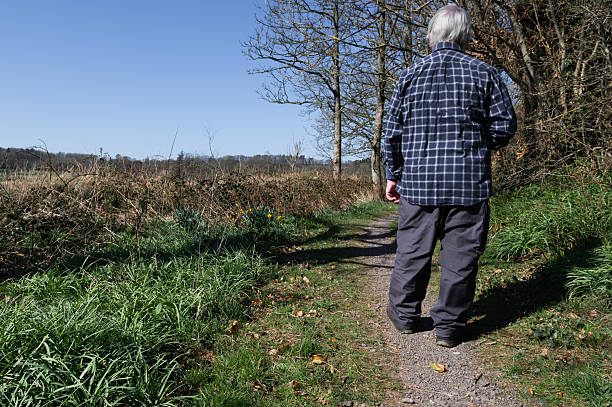 istock Active mature man walking on a rural footpath 2208268764