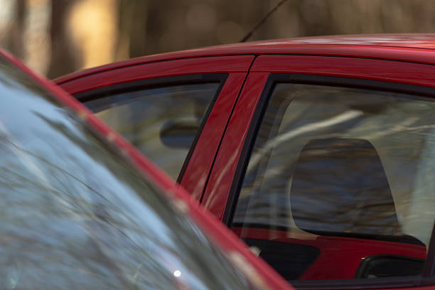 istock A red car interior with a beautiful reflection in the background 2208273010