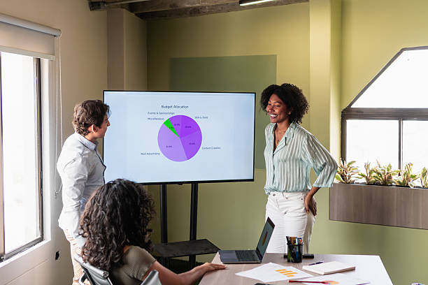 istock Marketing professionals discussing budget allocation in a meeting 2208273846