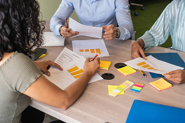 istock Business people analyzing charts and graphs during meeting 2208273949