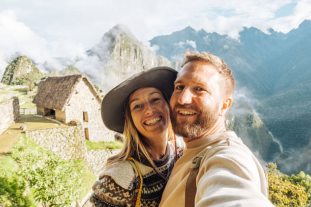istock Couple Taking Selfie at Machu Picchu with Mountainous Backdrop 2208276715