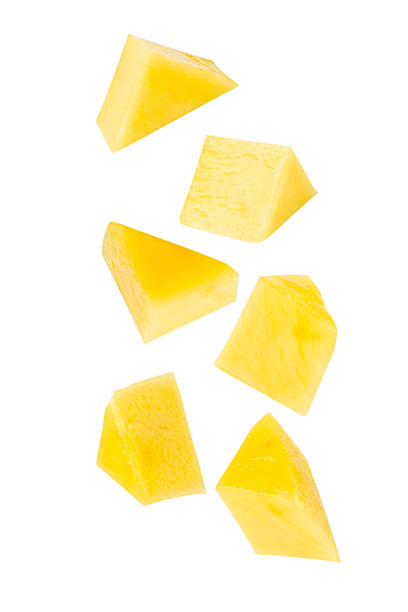 istock Falling Yellow Mango slices isolated on white background with clipping path, full depth of field 2208277105