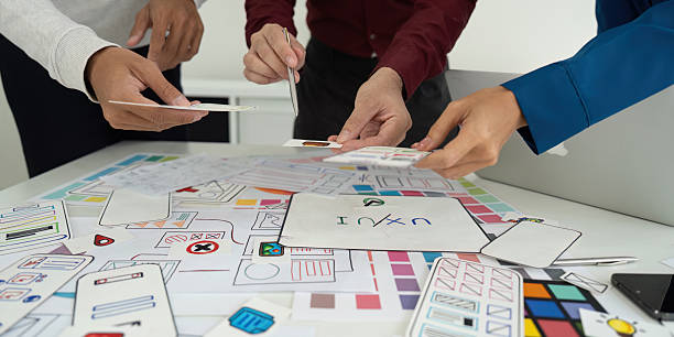 istock Team Meeting and Design Planning. Designers brainstorming ideas for a user-friendly interface. 2208277120