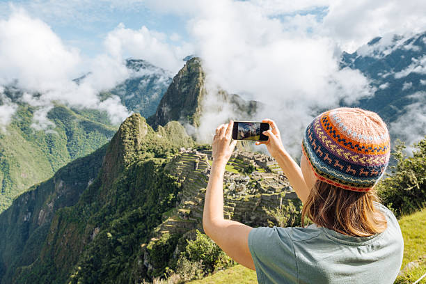 istock Tourist Capturing Majestic Mountain View at Machu Picchu 2208277561