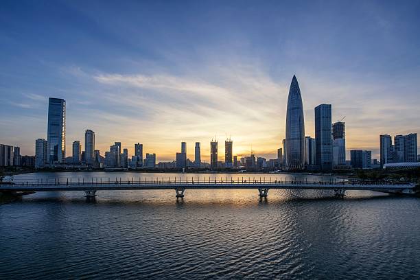 istock Sunset over modern city skyline and bridge. 2208278213