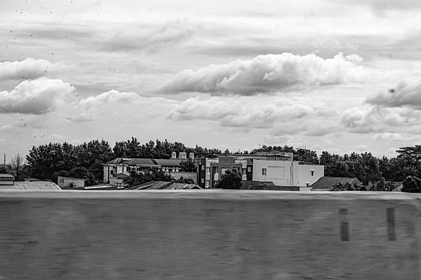 istock Rows of buildings under thick clouds in the sky 2208278631