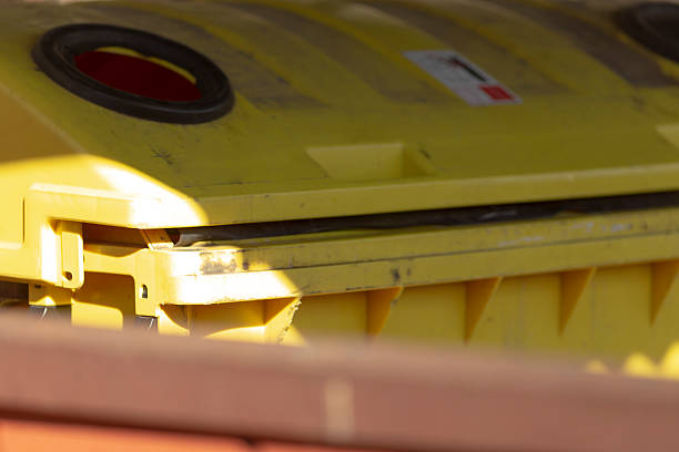 istock A bright yellow trash can featuring a prominent red circle on its lid 2208281889