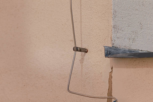 istock Wall Hook with Wire and Detailed Background Texture in Urban Setting 2208283424