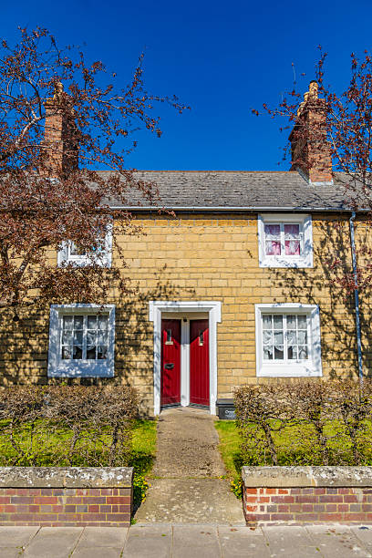 Chantmarle thatched cottage, near Cattistock, Dorset, England. Quaint and idyllic tranquil villages typify the Dorset landscape with stately homes, manor houses and traditional thatched cottages alongside the narrow roads