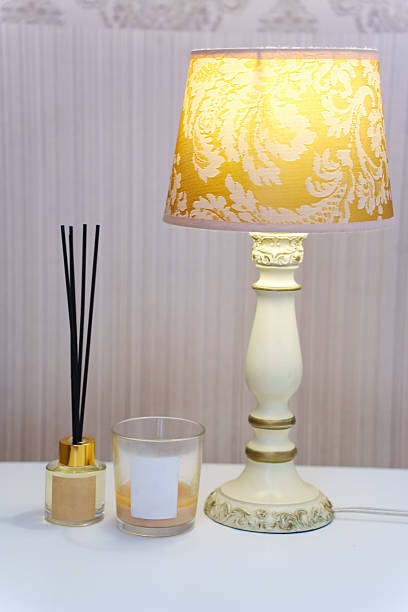 istock Elegant home decor with aromatic diffuser and vintage lamp 2208287981