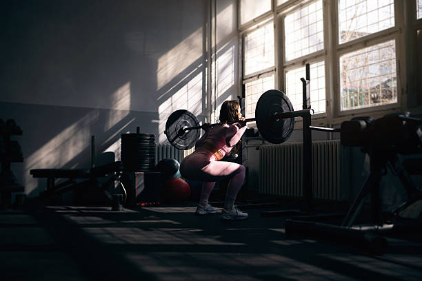 istock Young woman working out in a gym 2208288693