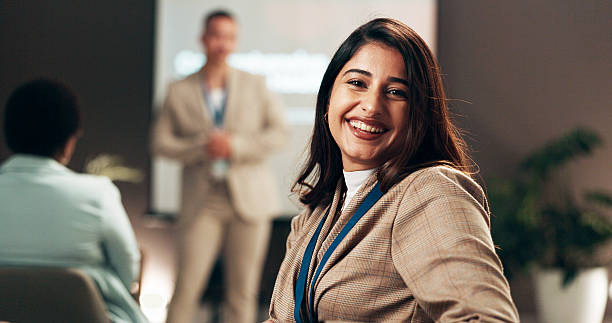 istock Woman, smile and portrait in audience at presentation, hall and learning at corporate conference. Person, happy and training in crowd at employee seminar, confident and career workshop for growth 2208292013