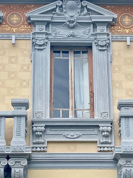 istock Baroque style decorated windows ornate window pediments, balustraded balcony, relief columns shield cartouche. 2208292237