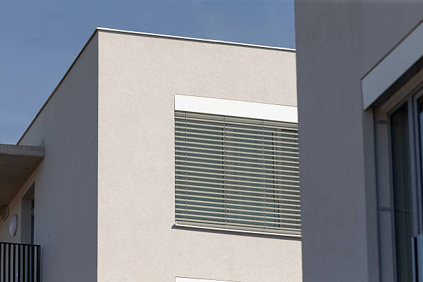 istock A building that features a balcony with a blue sky present in the background 2208292761