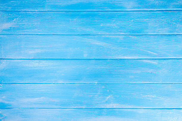 Light blue wooden background, wooden textured colored in blue and white, top view surface copy space