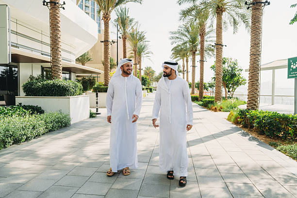 istock Two arab businessmen walking and talking in Dubai 2208295004