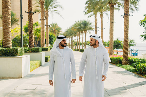 istock Two arab businessmen walking and talking in Dubai 2208295005