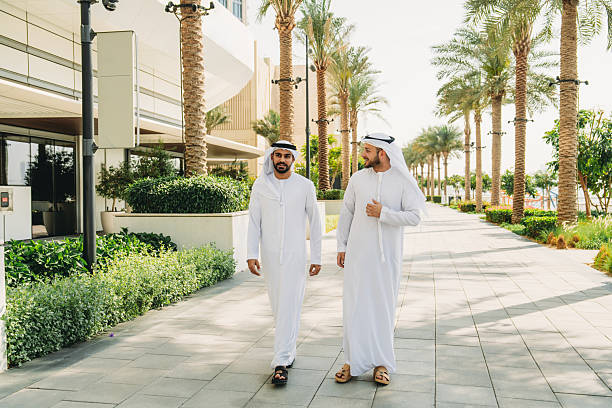 istock Arab businessmen walking and talking in Dubai 2208295014